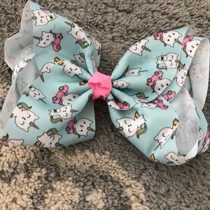 Teal and pink unikitty printed hair clip ribbon.